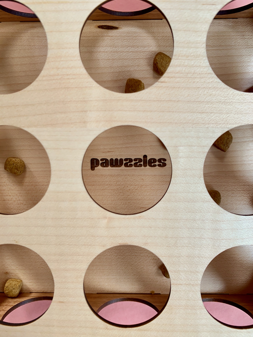 Close up of the pawzzles logo and toy.